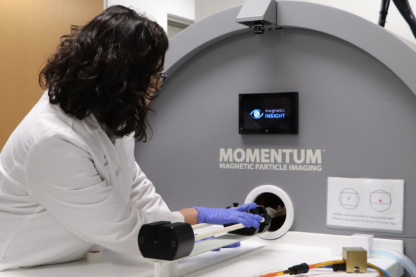 scientist using the molecular imaging lab equipment